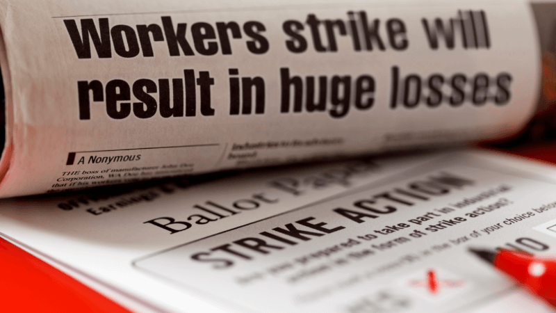 worker strike headline on newspaper